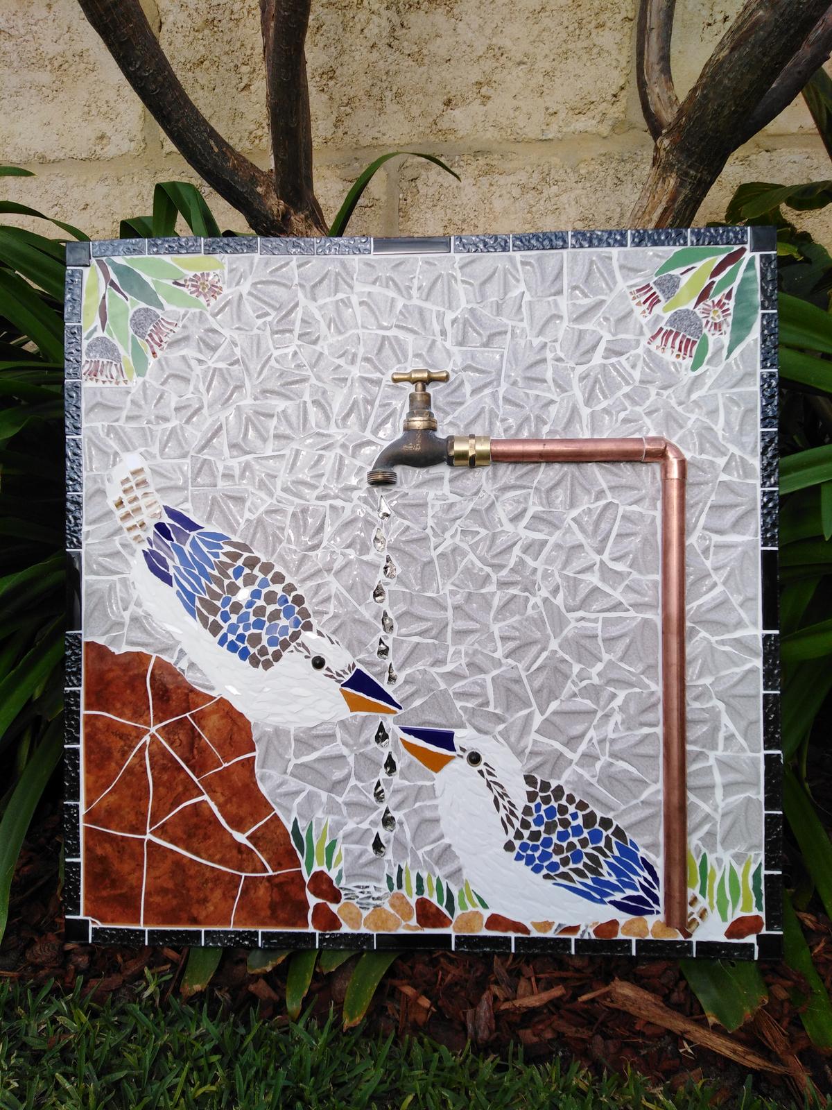 Kookas catching water from brass and copper tap