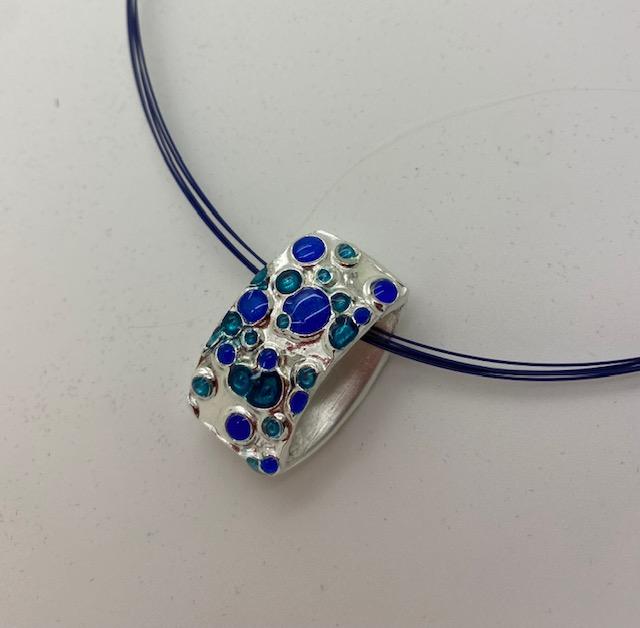 Silver pendant with coloured UV resin