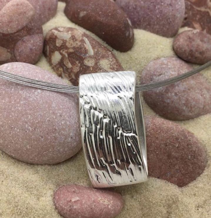 Silver double sided pendant from precious metal clay