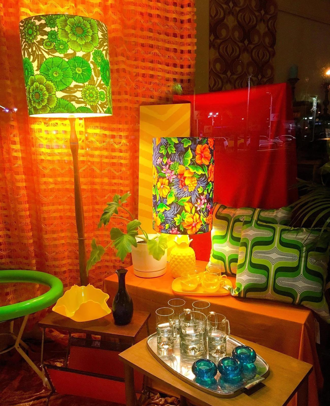 Window display with handmade cushions, lampshades and wall art