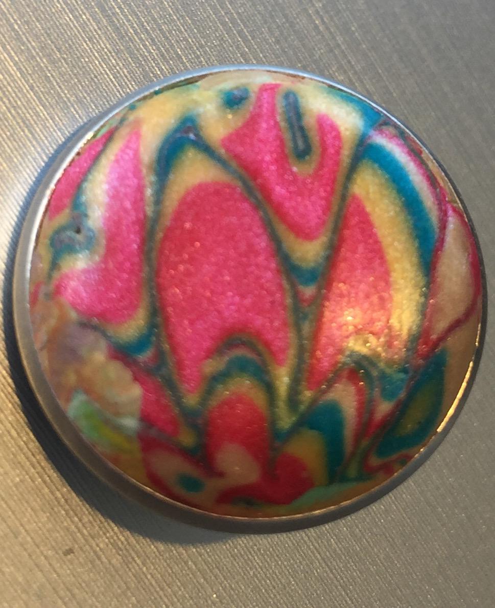 One of the inserts for the pendants that has been handmade with polmerclay