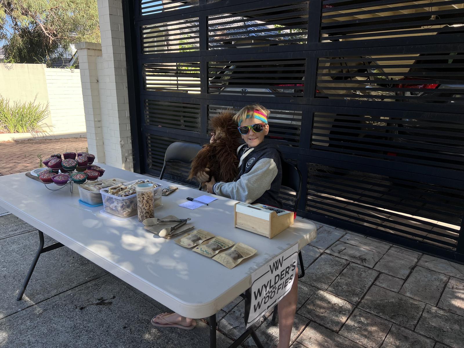 Wylder selling his dog treats in the community