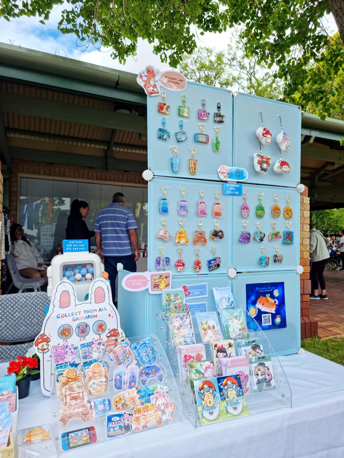 Close up of my handmade stickers and keychains made from my own art