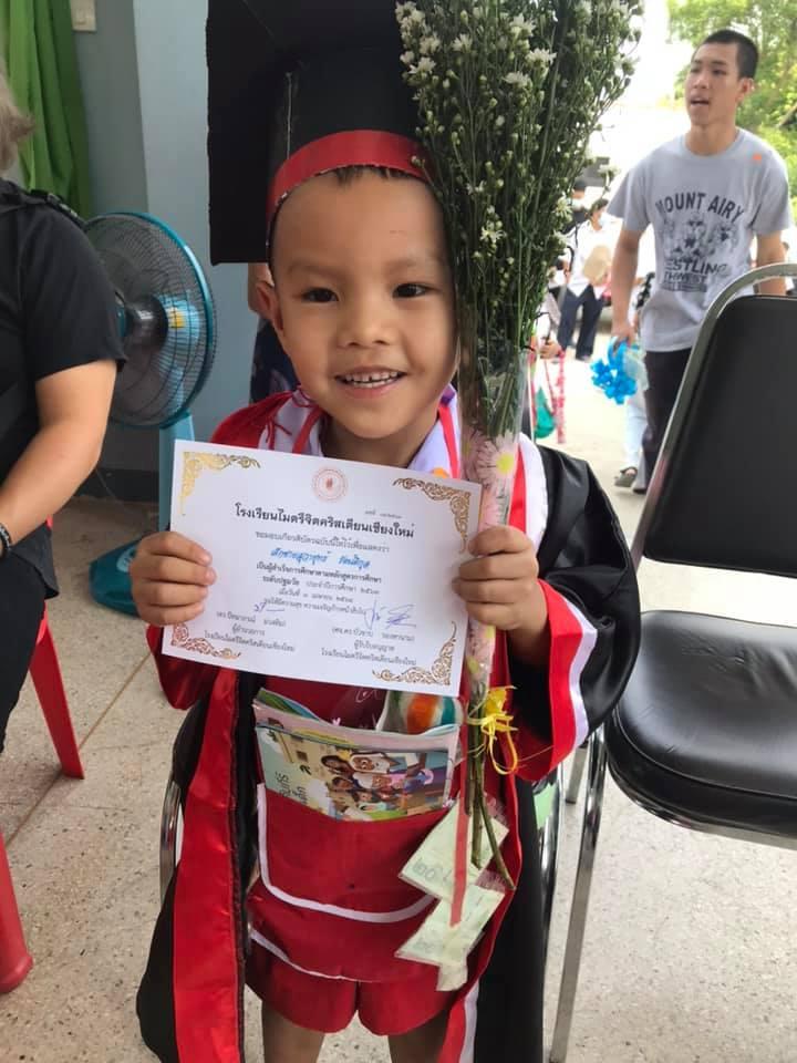 Sponsored child at school graduation