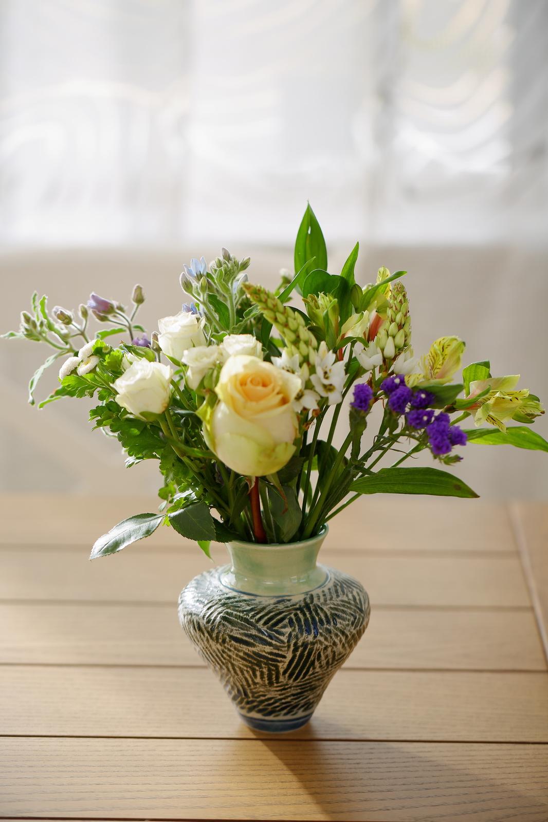Vase with carving textures and distinctive narrow foot