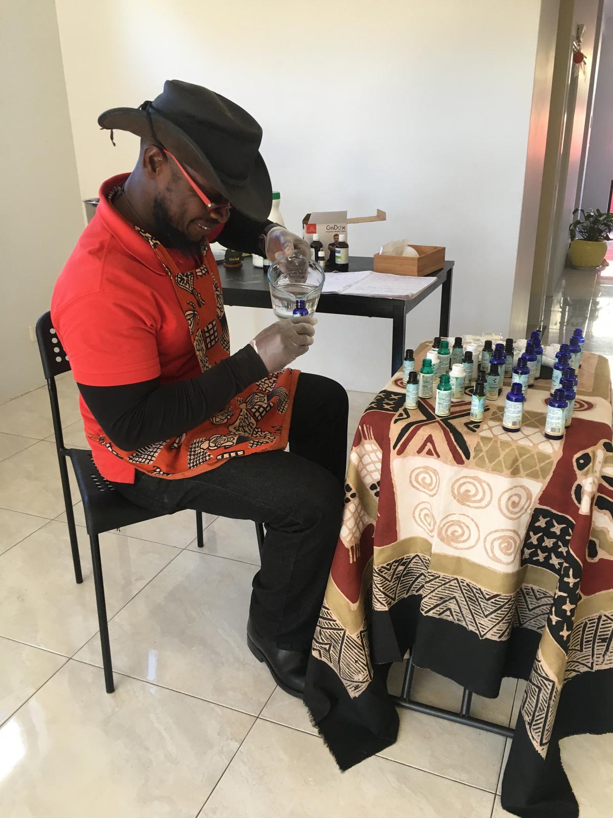 Handfilling each bottle with filtered water