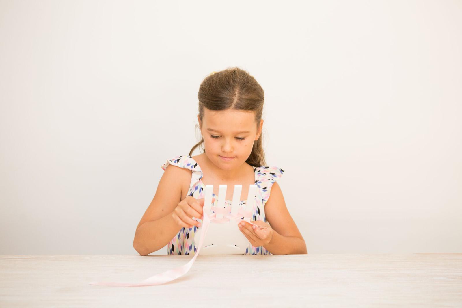 THE LITTLE BOW MAKER