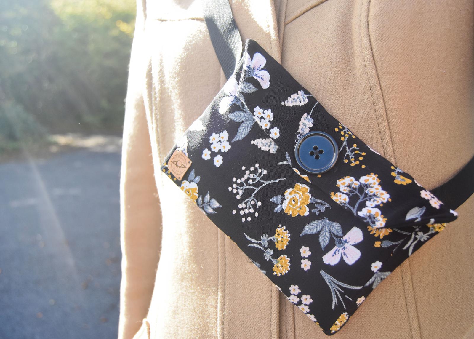 Black floral belt bag, worn cross body