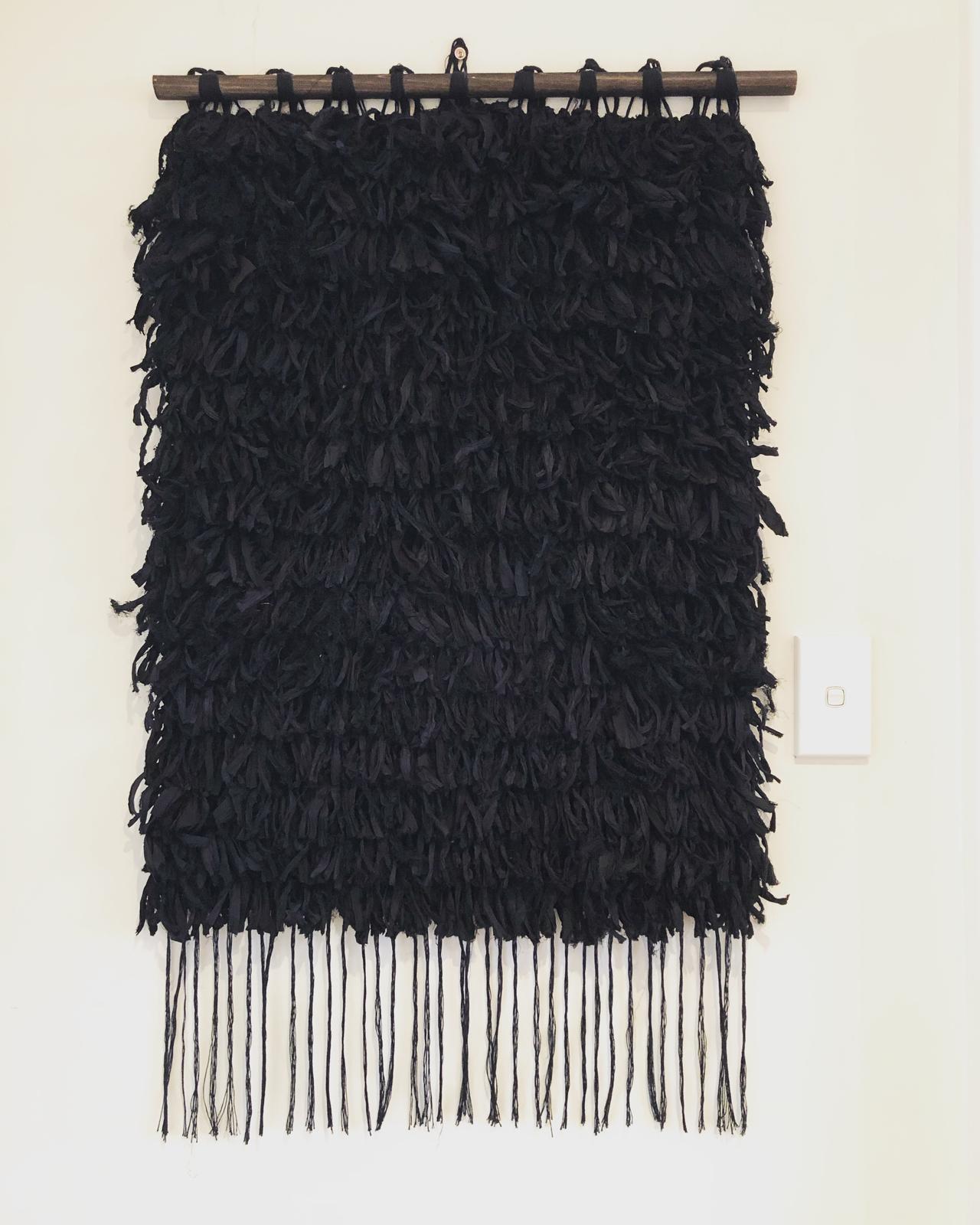 Hand weaved in sari silk and cotton.