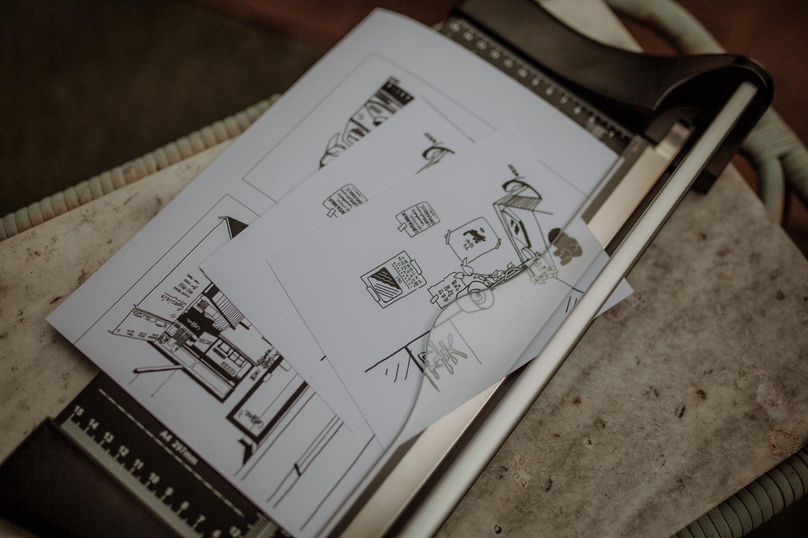 Kikitsa Draws postcards in guillotine
