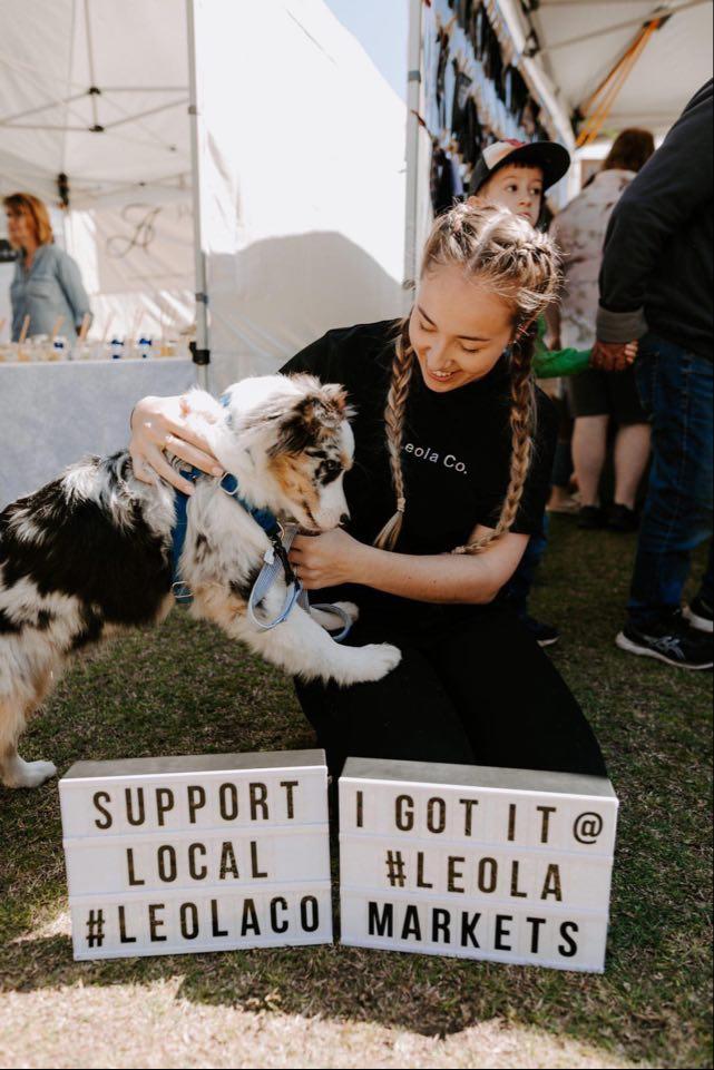 Myself at a market with one of our customers Koda