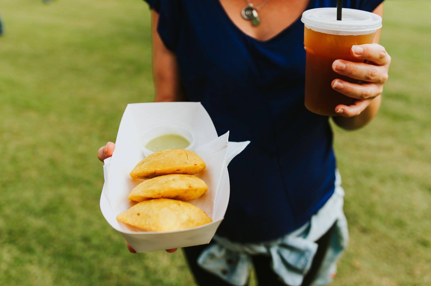Girl with empanadas and lemonade