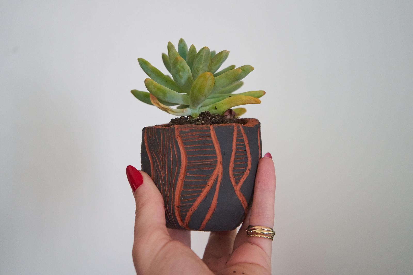 Hand carved pinch pot design
