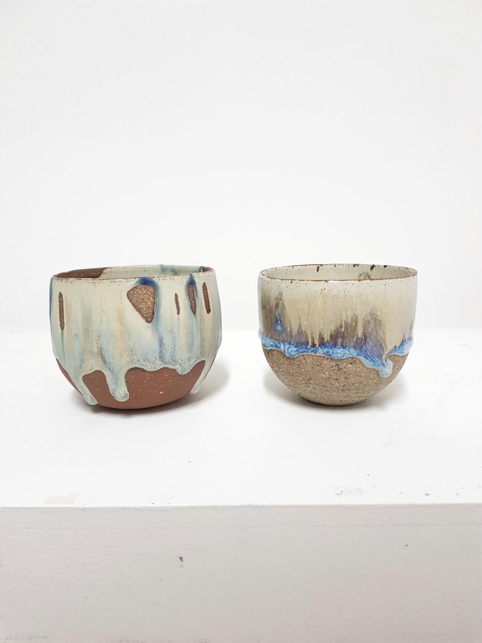 STONEWARE CUPS IN PATCH OF BLUE